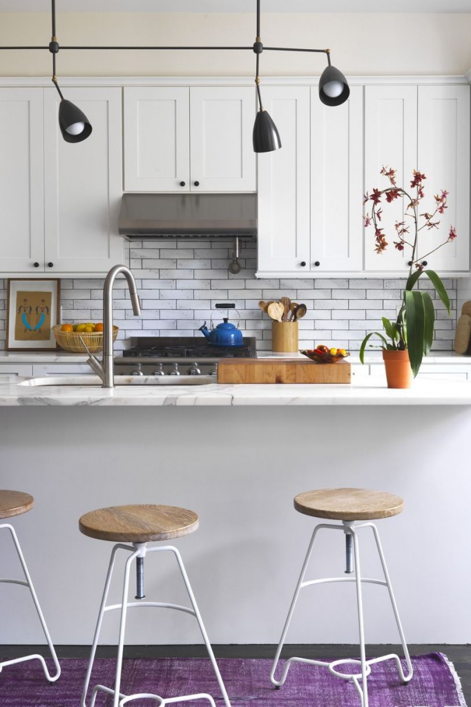 Stylish Small Kitchens, using all white on walls, cabinets, and backsplash and then add color with accents.