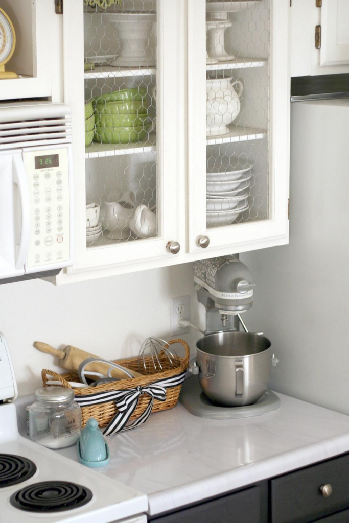 white kitchen cabinets with chicken wire instead of glass