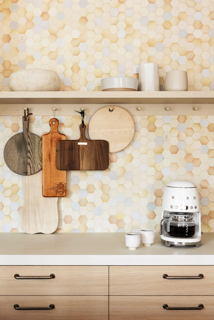 use cutting boards and utensils as artwork in the kitchen