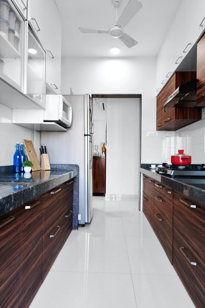 galley kitchen with upper cabinets