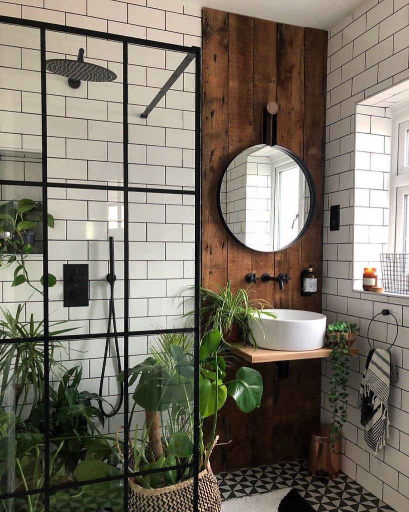 white subway tile with natural elements and plants in shower space