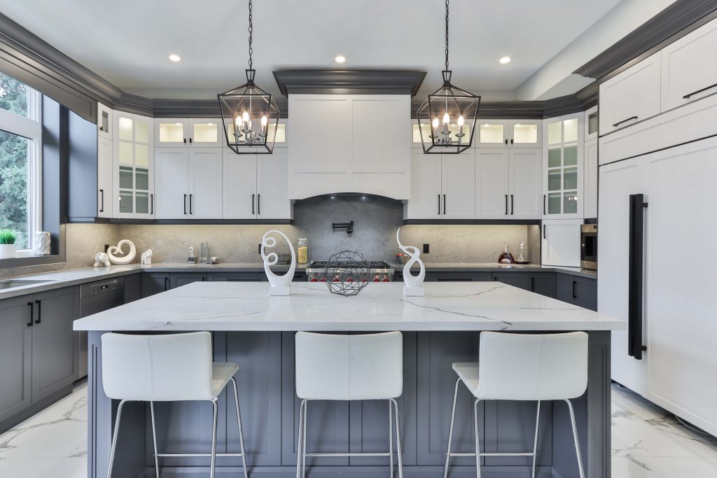 deep gray lower cabinets, white upper cabinets, matte black finishes