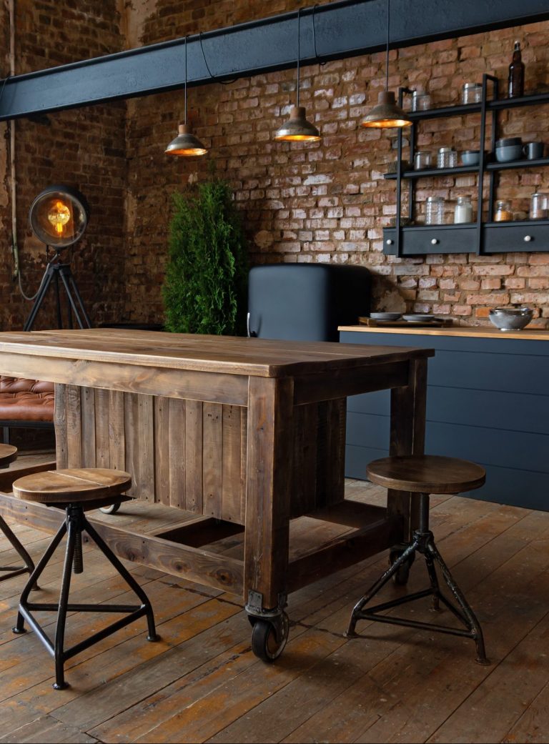 wooden table in an open industrial kitchen