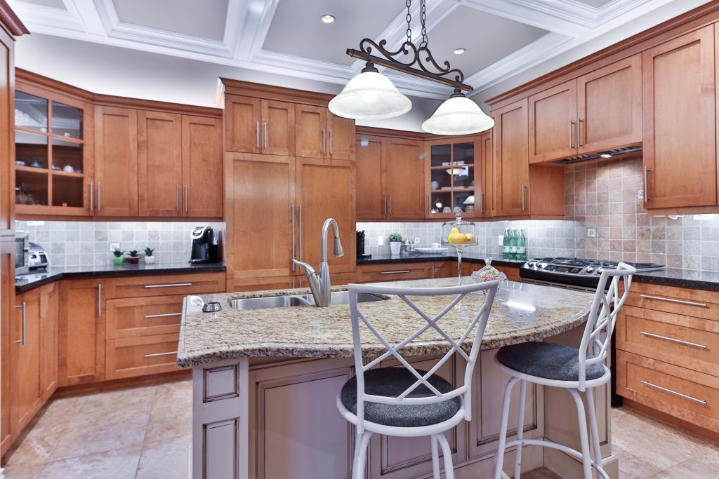 Traditional Style Kitchen, crown molding, carved wood, polished natural stone. 

Source: Unsplash sidekix-media-ZKnG_gm8X40-unsplash