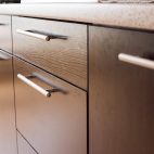dark wood drawer fronts with long bar handles