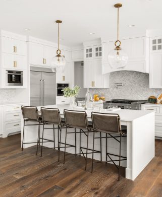 Beautiful kitchen in new luxury home, with waterfall island, sta