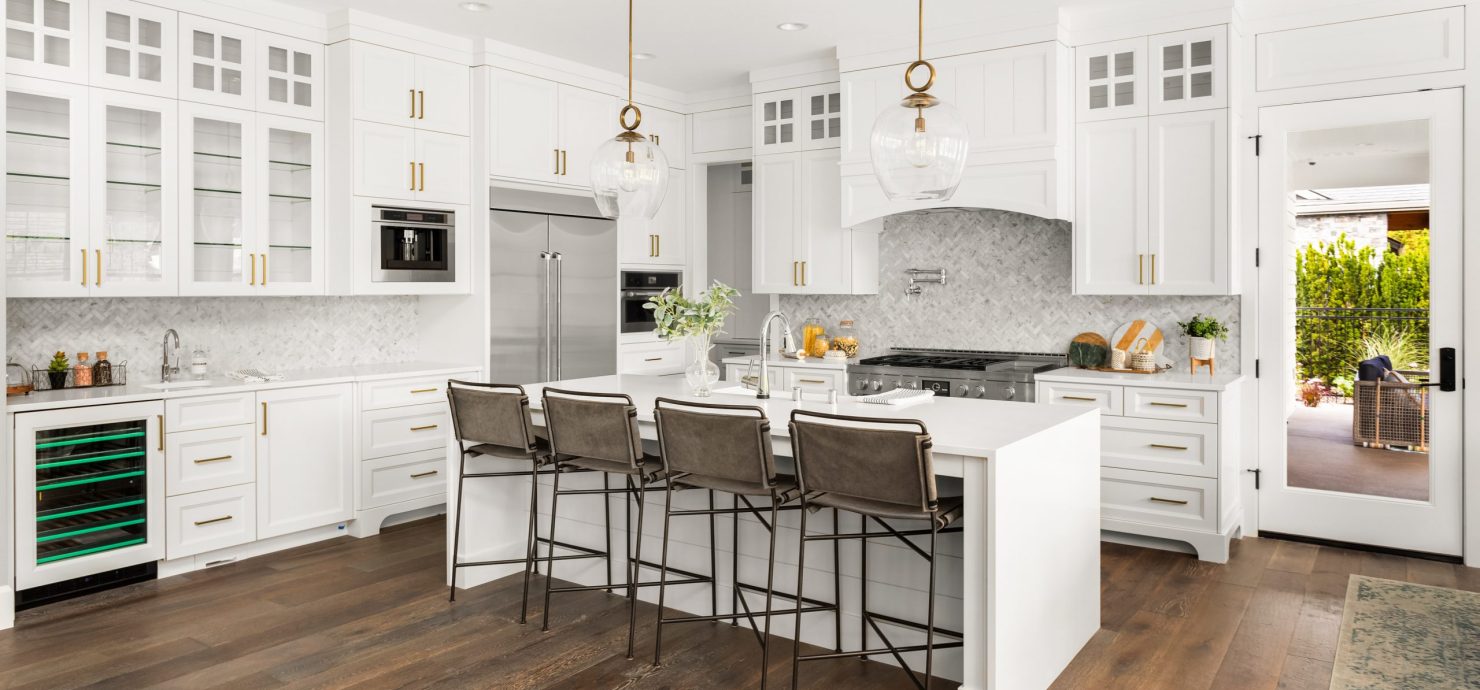 Beautiful kitchen in new luxury home, with waterfall island, sta