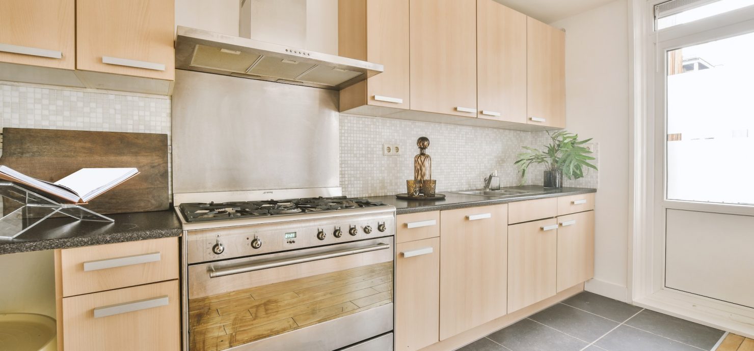 Cream colored kitchen cabinets