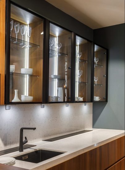 Renovated kitchen interior with glass cabinets