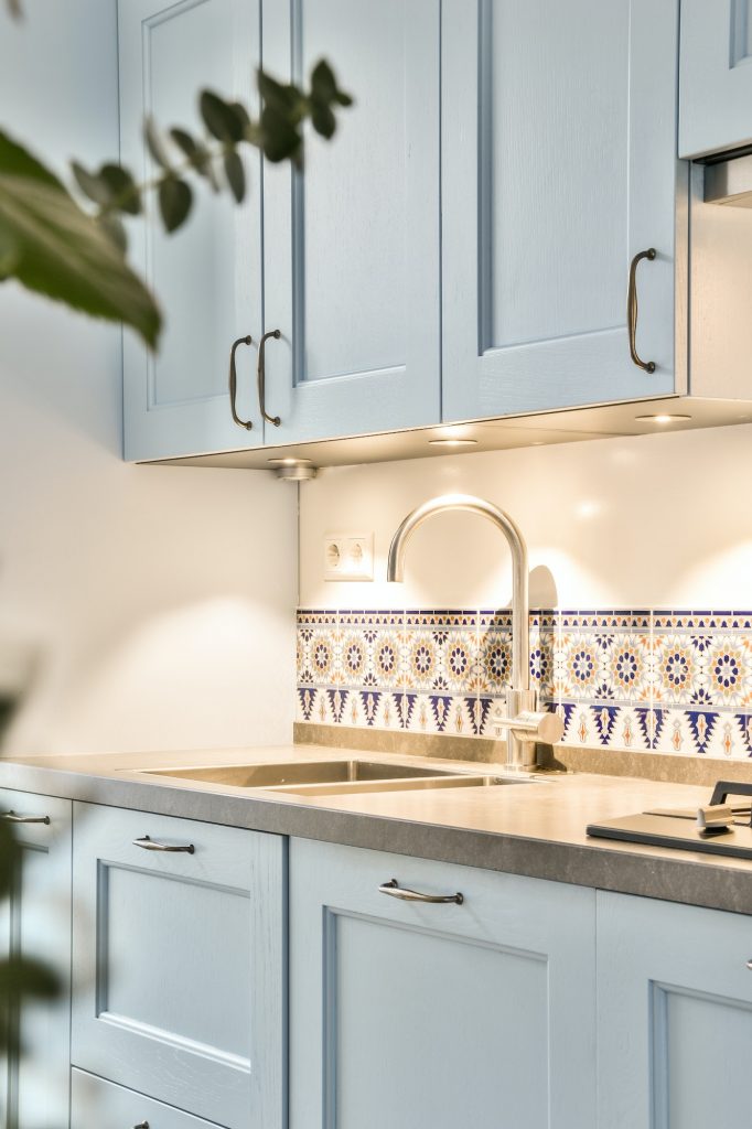 Interior of modern kitchen with blue furniture