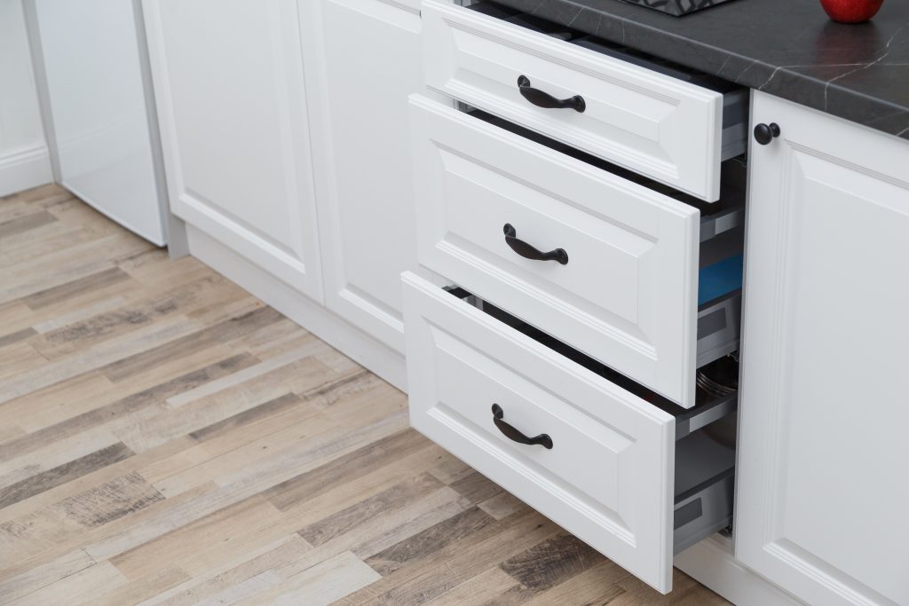 drawer slides in a set of kitchen drawers