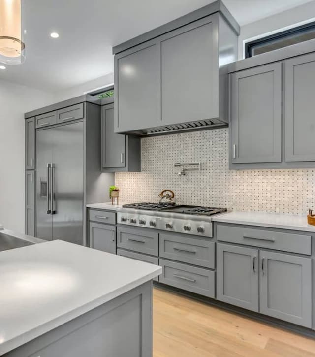 An image of a clean kitchen with new cabinet doors