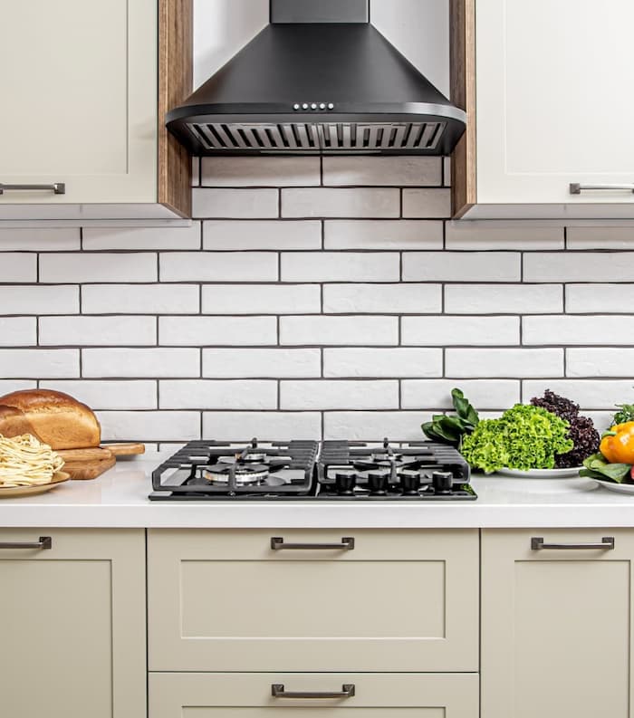 A counter and stove top with new drawer fronts